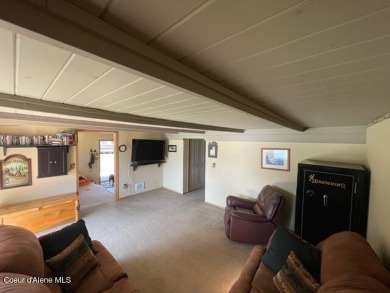 Seller financing available at 6%. Lakefront condo with a boat on Priest Lake Golf and Tennis Club in Idaho - for sale on GolfHomes.com, golf home, golf lot