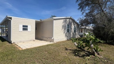 Welcome to this beautifully updated 2-bedroom, 2-bathroom home on Sabal Springs Golf and Racquet Club in Florida - for sale on GolfHomes.com, golf home, golf lot