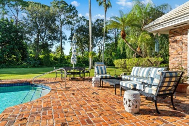 Elegant brick ranch-style estate sits on a meticulously on Country Club of Florida in Florida - for sale on GolfHomes.com, golf home, golf lot