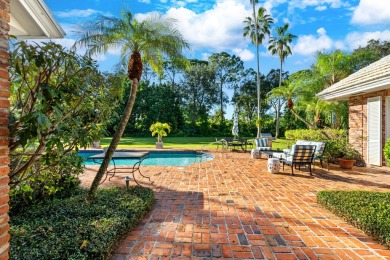 Elegant brick ranch-style estate sits on a meticulously on Country Club of Florida in Florida - for sale on GolfHomes.com, golf home, golf lot