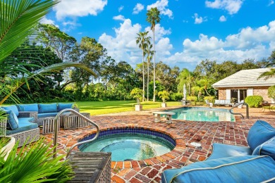 Elegant brick ranch-style estate sits on a meticulously on Country Club of Florida in Florida - for sale on GolfHomes.com, golf home, golf lot