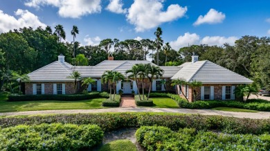 Elegant brick ranch-style estate sits on a meticulously on Country Club of Florida in Florida - for sale on GolfHomes.com, golf home, golf lot