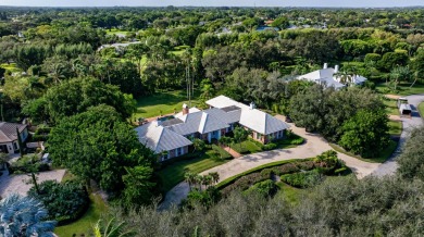 Elegant brick ranch-style estate sits on a meticulously on Country Club of Florida in Florida - for sale on GolfHomes.com, golf home, golf lot