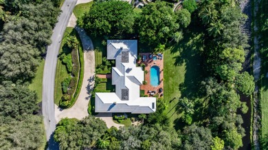 Elegant brick ranch-style estate sits on a meticulously on Country Club of Florida in Florida - for sale on GolfHomes.com, golf home, golf lot