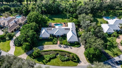 Elegant brick ranch-style estate sits on a meticulously on Country Club of Florida in Florida - for sale on GolfHomes.com, golf home, golf lot