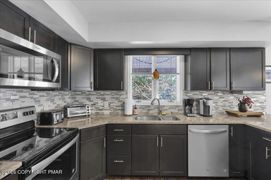 Beautiful contemporary mountain home offering 3 bedrooms, 2 full on Split Rock Resort and Country Club in Pennsylvania - for sale on GolfHomes.com, golf home, golf lot