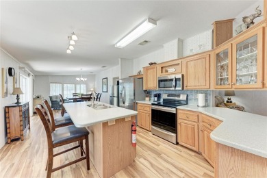 Welcome to this 3-bedroom, 2-bath fully furnished turnkey mobile on Kings Gate Golf Club in Florida - for sale on GolfHomes.com, golf home, golf lot