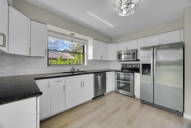 Don't miss this beautifully renovated, single-story corner on Martin Downs Country Club in Florida - for sale on GolfHomes.com, golf home, golf lot