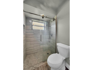 Don't miss this beautifully renovated, single-story corner on Martin Downs Country Club in Florida - for sale on GolfHomes.com, golf home, golf lot