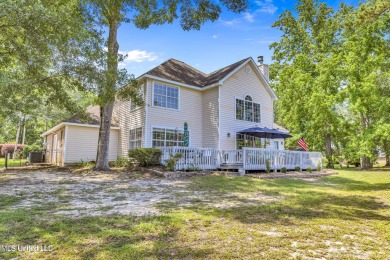 Step into this beautiful home right on the GOLF COURSE with high on Diamondhead Country Club in Mississippi - for sale on GolfHomes.com, golf home, golf lot