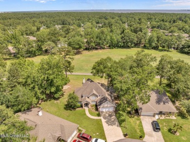 Step into this beautiful home right on the GOLF COURSE with high on Diamondhead Country Club in Mississippi - for sale on GolfHomes.com, golf home, golf lot