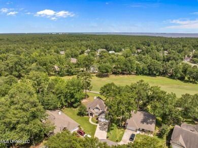 Step into this beautiful home right on the GOLF COURSE with high on Diamondhead Country Club in Mississippi - for sale on GolfHomes.com, golf home, golf lot