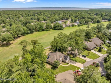 Step into this beautiful home right on the GOLF COURSE with high on Diamondhead Country Club in Mississippi - for sale on GolfHomes.com, golf home, golf lot