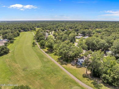 Step into this beautiful home right on the GOLF COURSE with high on Diamondhead Country Club in Mississippi - for sale on GolfHomes.com, golf home, golf lot