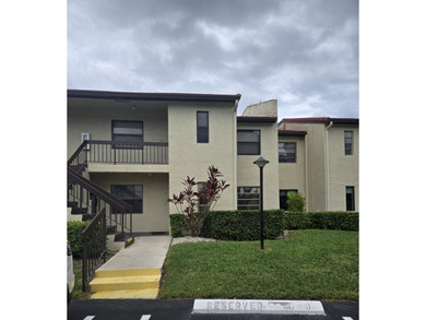 FIRST FLOOR 2 BEDROOM 2 BATH UNIT ON GOLF COURSE. GLASS ENCLOSED on  in Florida - for sale on GolfHomes.com, golf home, golf lot