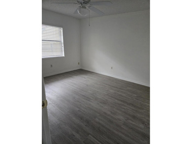 FIRST FLOOR 2 BEDROOM 2 BATH UNIT ON GOLF COURSE. GLASS ENCLOSED on  in Florida - for sale on GolfHomes.com, golf home, golf lot