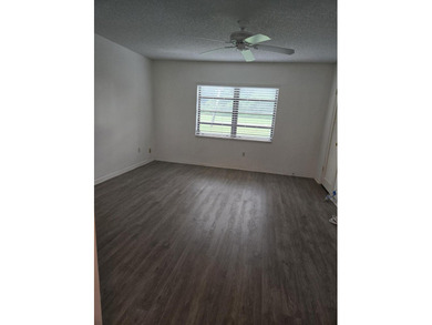 FIRST FLOOR 2 BEDROOM 2 BATH UNIT ON GOLF COURSE. GLASS ENCLOSED on  in Florida - for sale on GolfHomes.com, golf home, golf lot