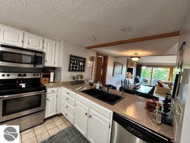 This exceptional three-bedroom, three-and-a-half bathroom condo on Shanty Creek Golf Course in Michigan - for sale on GolfHomes.com, golf home, golf lot
