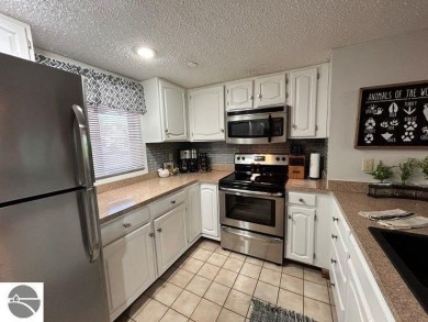 This exceptional three-bedroom, three-and-a-half bathroom condo on Shanty Creek Golf Course in Michigan - for sale on GolfHomes.com, golf home, golf lot