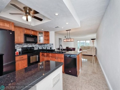 ALL IMPACT WINDOWS, PATIO  FRONT DOOR. OPEN KITCHEN REAL WOOD on Wynmoor Golf Course in Florida - for sale on GolfHomes.com, golf home, golf lot