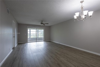 Spacious 2 bedroom 2 bath with large ENCLOSED BALCONY , storage on Flamingo Lakes Country Club in Florida - for sale on GolfHomes.com, golf home, golf lot