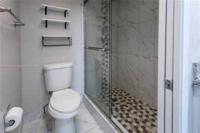 Spacious 2 bedroom 2 bath with large ENCLOSED BALCONY , storage on Flamingo Lakes Country Club in Florida - for sale on GolfHomes.com, golf home, golf lot