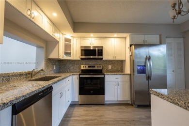 Spacious 2 bedroom 2 bath with large ENCLOSED BALCONY , storage on Flamingo Lakes Country Club in Florida - for sale on GolfHomes.com, golf home, golf lot