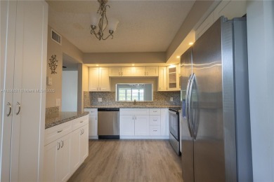 Spacious 2 bedroom 2 bath with large ENCLOSED BALCONY , storage on Flamingo Lakes Country Club in Florida - for sale on GolfHomes.com, golf home, golf lot