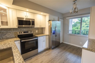 Spacious 2 bedroom 2 bath with large ENCLOSED BALCONY , storage on Flamingo Lakes Country Club in Florida - for sale on GolfHomes.com, golf home, golf lot