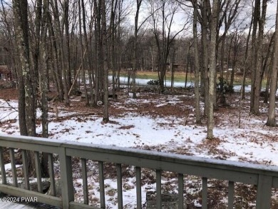 Bordering the 13th fairway, this Tanglwood Lakes homes offers 3 on Paupack Hills Golf and Country Club in Pennsylvania - for sale on GolfHomes.com, golf home, golf lot