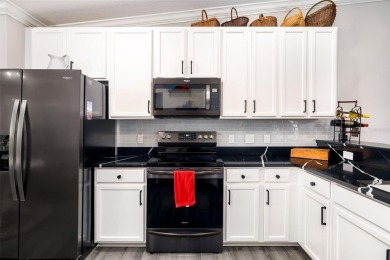 Welcome to this beautifully updated end-unit condo offering on River Strand Golf and Country Club At Heritage Harbour  in Florida - for sale on GolfHomes.com, golf home, golf lot
