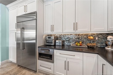 This stunning home, complete with impact windows and door and on Hobe Sound Golf Club in Florida - for sale on GolfHomes.com, golf home, golf lot