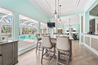 This stunning home, complete with impact windows and door and on Hobe Sound Golf Club in Florida - for sale on GolfHomes.com, golf home, golf lot
