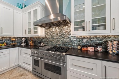 This stunning home, complete with impact windows and door and on Hobe Sound Golf Club in Florida - for sale on GolfHomes.com, golf home, golf lot