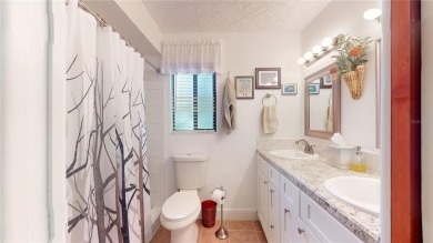 Welcome to this beautifully maintained 3-bedroom, 2-bath gem on The Grand Club - Pine Lakes Course in Florida - for sale on GolfHomes.com, golf home, golf lot