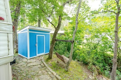 Take a look at this camper with a sunroom located in Holiday Out on Lake Tansi Village Country Club in Tennessee - for sale on GolfHomes.com, golf home, golf lot