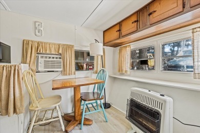 Take a look at this camper with a sunroom located in Holiday Out on Lake Tansi Village Country Club in Tennessee - for sale on GolfHomes.com, golf home, golf lot