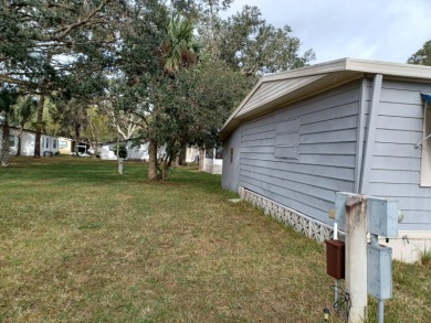 Come settle down and relax in a beautiful manufactured home with on Fairways Country Club in Florida - for sale on GolfHomes.com, golf home, golf lot