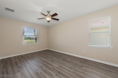 This beautifully designed, open concept home overlooks the 12th on Herons Glen Golf and Country Club in Florida - for sale on GolfHomes.com, golf home, golf lot
