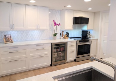 Welcome to this fully renovated 2-bedroom, 2-bath residence on Isla Del Sol Yacht and Country Club in Florida - for sale on GolfHomes.com, golf home, golf lot