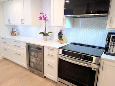 Welcome to this fully renovated 2-bedroom, 2-bath residence on Isla Del Sol Yacht and Country Club in Florida - for sale on GolfHomes.com, golf home, golf lot