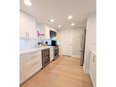 Welcome to this fully renovated 2-bedroom, 2-bath residence on Isla Del Sol Yacht and Country Club in Florida - for sale on GolfHomes.com, golf home, golf lot