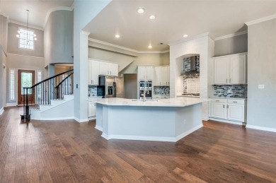 Resort-Style Living with Stunning Water Views in Gated Frisco on Heritage Lakes - Par 3 - 9 Hole Course in Texas - for sale on GolfHomes.com, golf home, golf lot