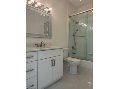 Experience refined Florida living in this beautifully remodeled on Vineyards Golf and Country Club in Florida - for sale on GolfHomes.com, golf home, golf lot