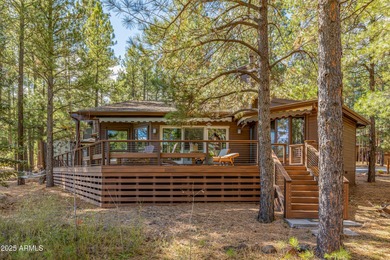 Escape to this pristine and well-cared-for cabin nestled among on Forest Highlands Golf Club - The Canyon in Arizona - for sale on GolfHomes.com, golf home, golf lot