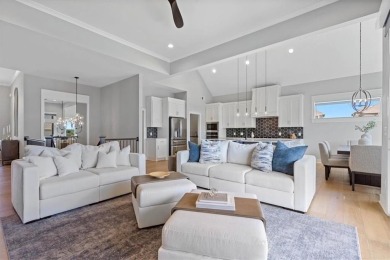 This 4-bedroom, 4-bath reverse 1.5-story is packed with upgrades on Heritage Park Golf Course in Kansas - for sale on GolfHomes.com, golf home, golf lot