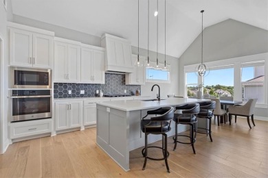 This 4-bedroom, 4-bath reverse 1.5-story is packed with upgrades on Heritage Park Golf Course in Kansas - for sale on GolfHomes.com, golf home, golf lot