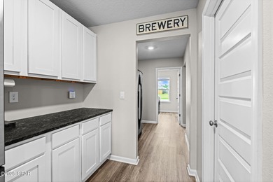 This exquisite 5-bedroom, 4-bathroom home boasts 4,128 sq/ft of on Bay Dunes in Florida - for sale on GolfHomes.com, golf home, golf lot