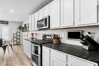 This exquisite 5-bedroom, 4-bathroom home boasts 4,128 sq/ft of on Bay Dunes in Florida - for sale on GolfHomes.com, golf home, golf lot