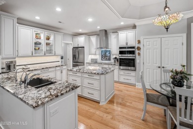 Welcome to 704 Squire Lane, where timeless elegance meets modern on Porters Neck Country Club in North Carolina - for sale on GolfHomes.com, golf home, golf lot